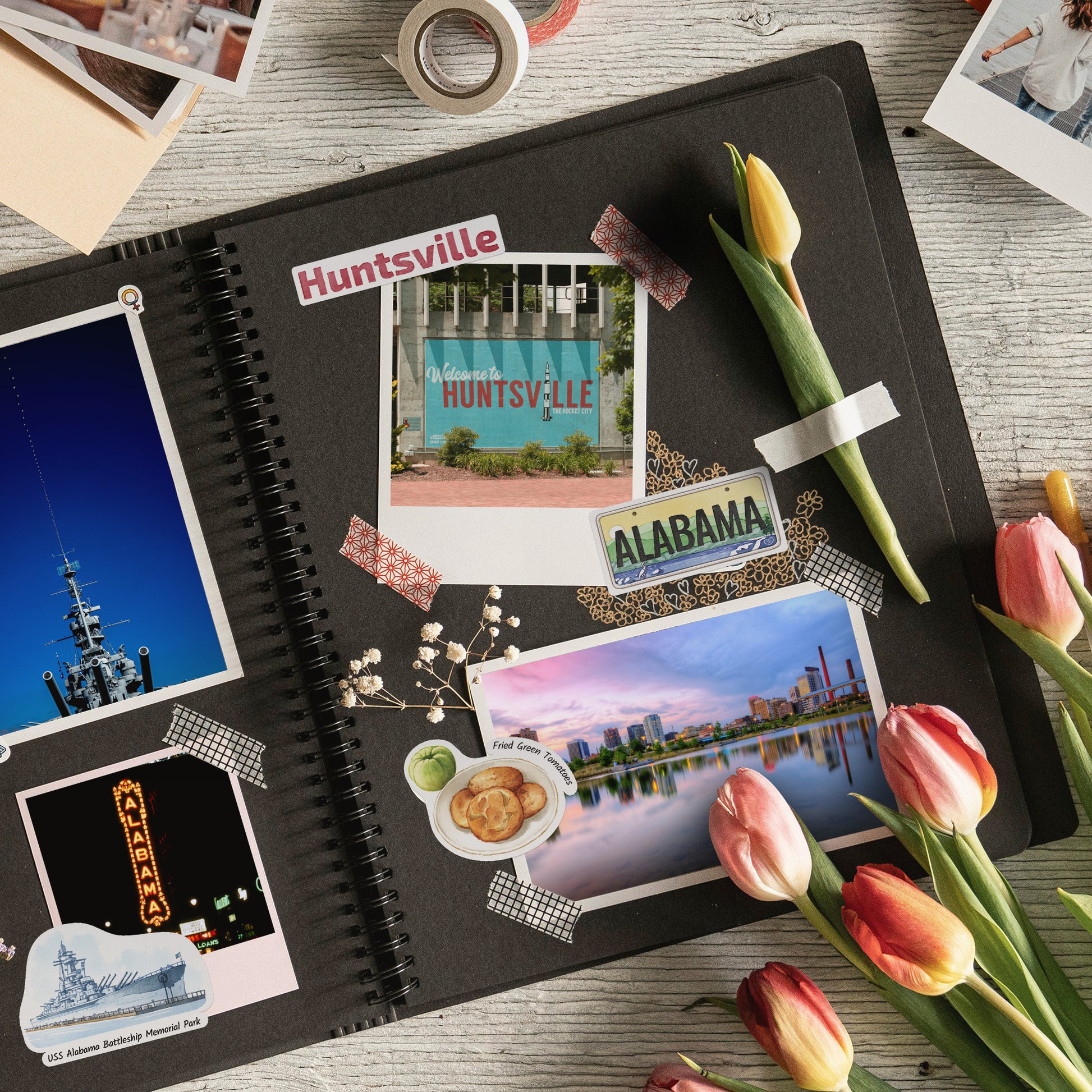 'Huntsville' and 'ALABAMA' stickers on a black scrapbook page with travel photos and tulips
