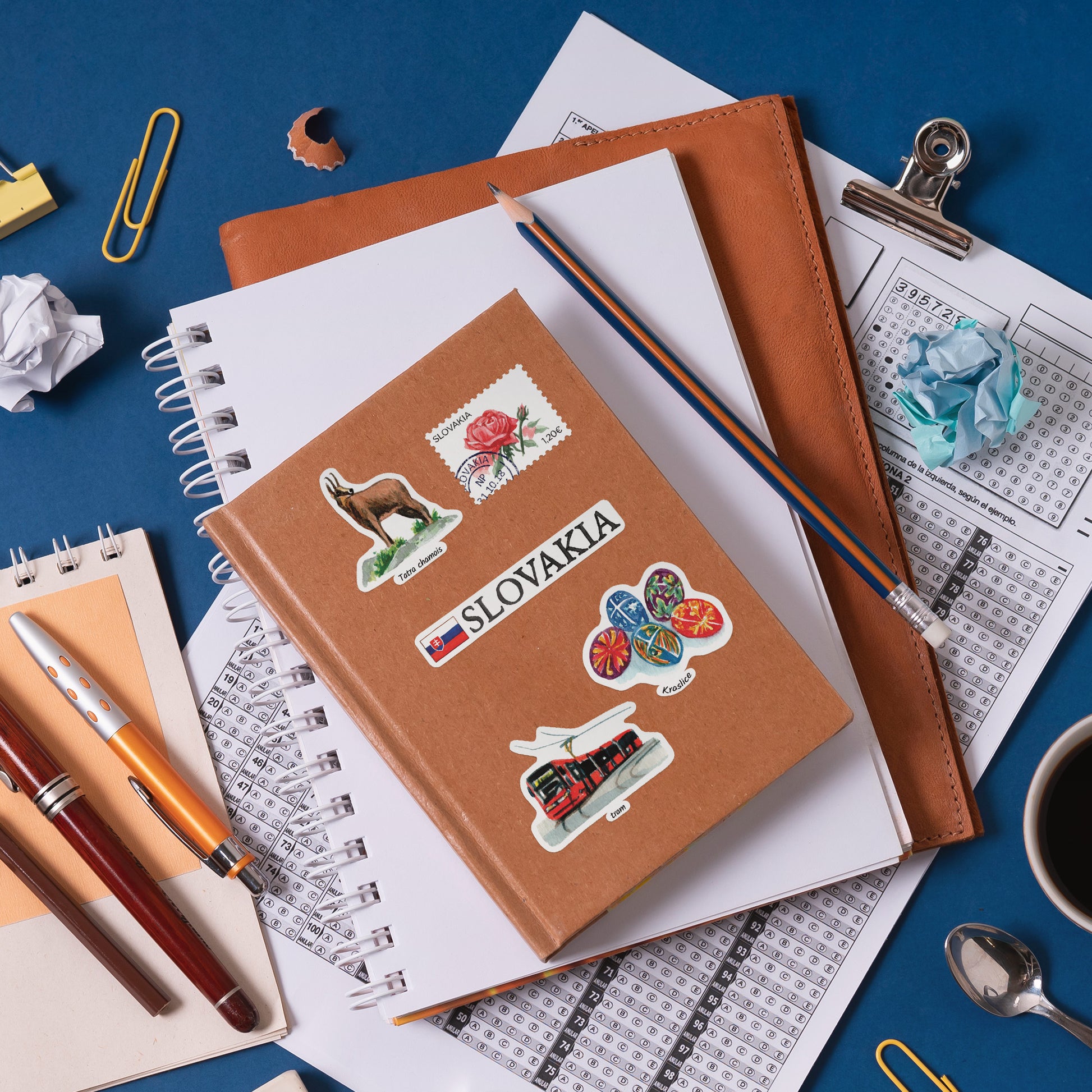 'SLOVAKIA', Tatra chamois, rose stamp and kraslice egg stickers on a tan leather notebook