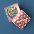 Open pink polka-dot gift box holding Saint Louis Zoo and blues musician die-cut stickers.