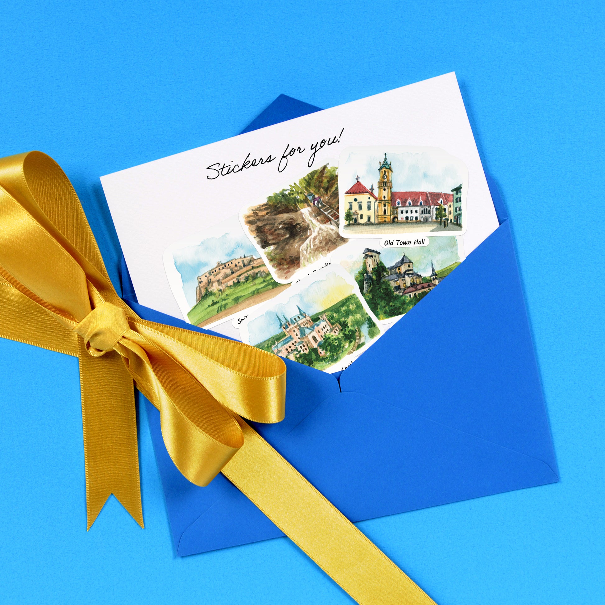 Spiš Castle and Old Town Hall stickers on a 'Stickers for you!' card in a blue envelope with a gold bow
