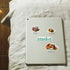 Turkish coffee, baklava and "Istanbul" stickers on a pale tablet back resting on linen