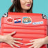 Licitar heart, Croatian flag, Dubrovnik Old Town and 'CROATIA' stickers on a red hard-shell suitcase