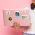 Iris stamp, Zlatni Rat, Rector's Palace and 'Pula' stickers on a pale pink laptop lid
