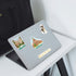 Boston terrier, Gardner Museum and 'Beacon Hill' stickers on a silver laptop on a white desk