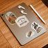Freedom Trail, 'Entering Boston' sign, Paul Revere statue and cannoli stickers on a tablet with earbuds
