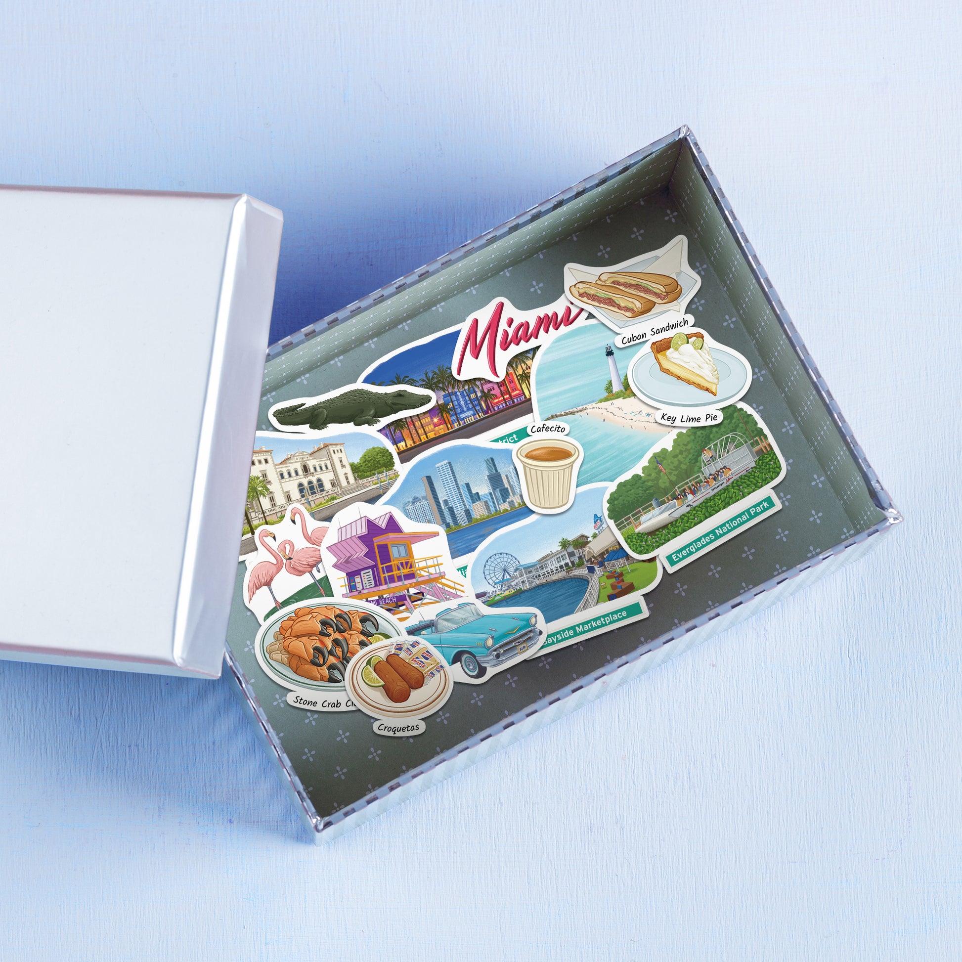 Miami stickers in a white gift box, including Miami Skyline, flamingos, stone crab claws and croquetas