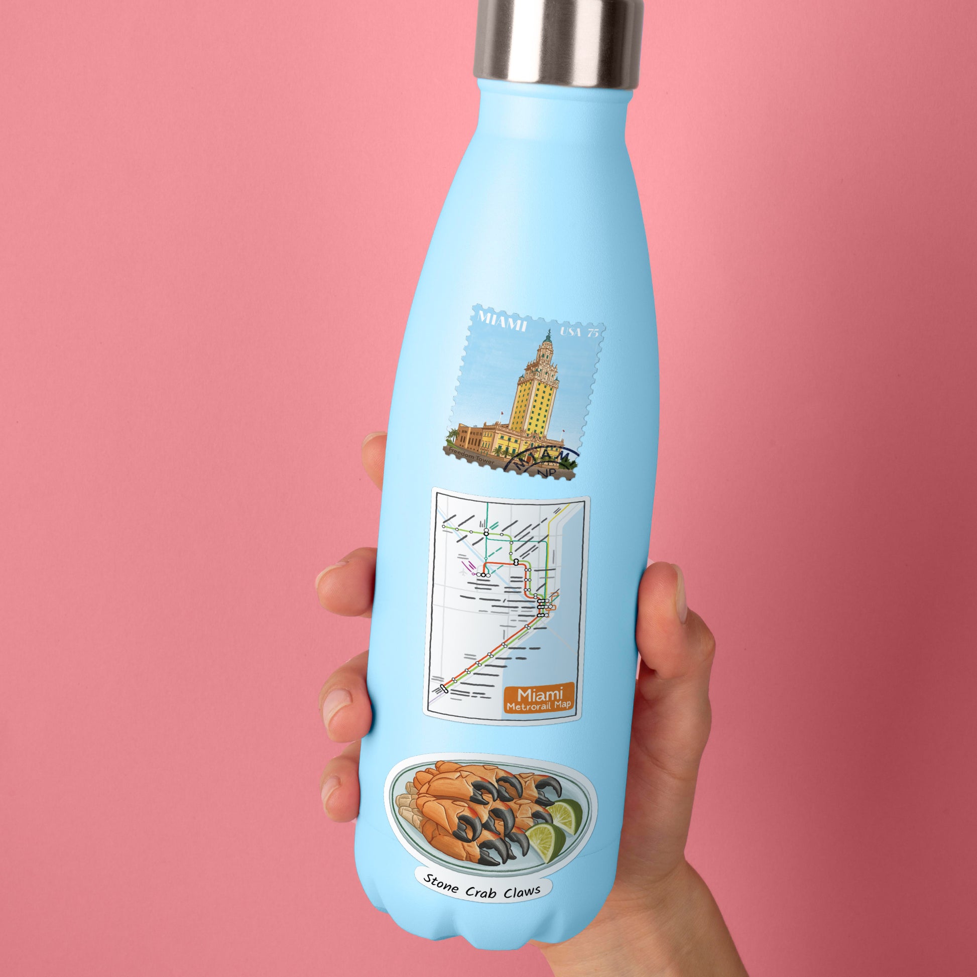 Freedom Tower, Metrorail map and stone crab claw stickers on a pale blue steel water bottle