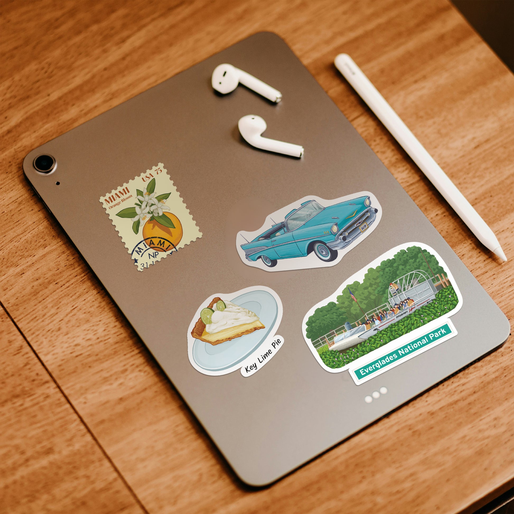 Vintage turquoise convertible, key lime pie and Everglades stickers on the back of a grey tablet