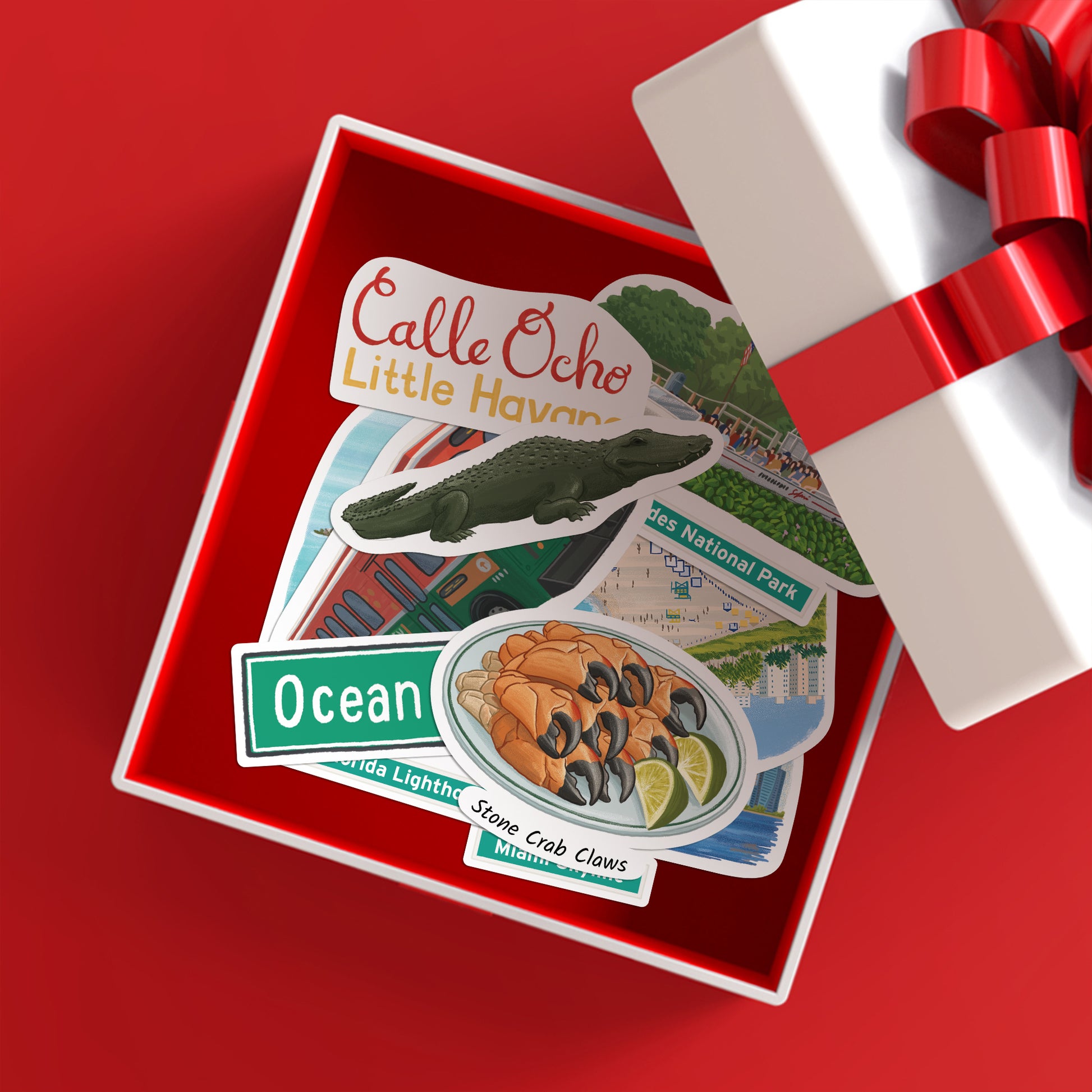 "Calle Ocho Little Havana", alligator and stone crab claw stickers in an open gift box with red ribbon