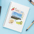 A spiral-bound notebook with Chile-themed stickers and illustrations, photographed from above on a light blue surface with a pen nearby.